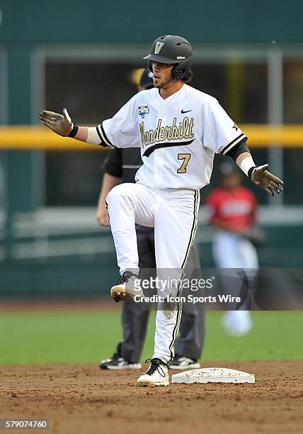 The Commodore's Dansby Swanson celebrates after hitting a double during the College World Series game between the Vanderbilt Commodores and the...
