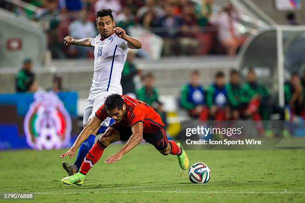 Mexico forward Javier Antonio Orozco and Chile defender Gonzalo Jara battle for possession, during the game between Mexico and Chile at Levi's...