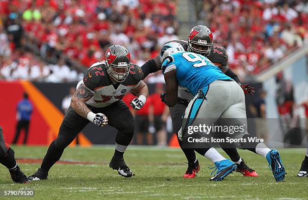 Tampa Bay Buccaneers offensive tackle Garrett Gilkey and Tampa Bay Buccaneers tackle Anthony Collins block Carolina Panthers defensive tackle Kawann...