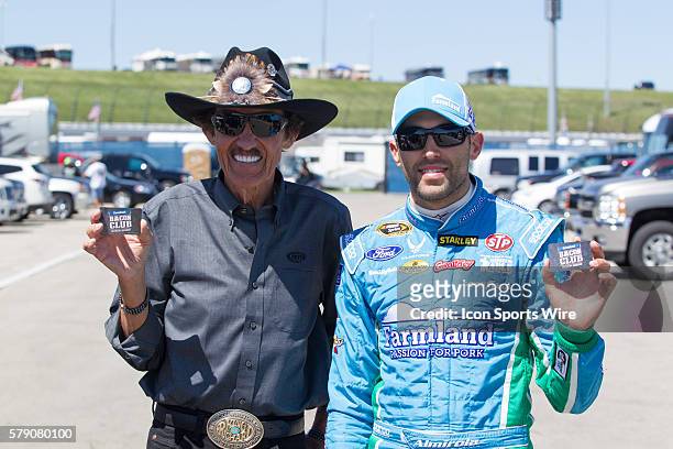 The King, Richard Petty with Aric Almirola , driver of the Farmland Ford hold up Farmland Bacon Club member cards. Almirola qualified 12th for...