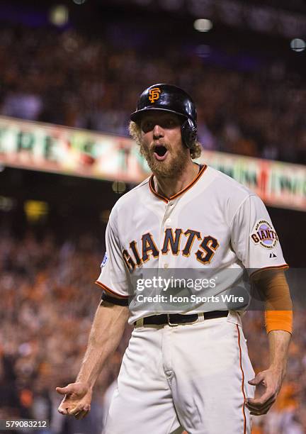 San Francisco Giants right fielder Hunter Pence reacts in celebration after scoring in the 8th inning on a two-run double by San Francisco Giants...