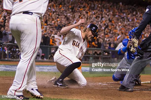 San Francisco Giants right fielder Hunter Pence slides home behind San Francisco Giants third baseman Pablo Sandoval on a two-run double by San...