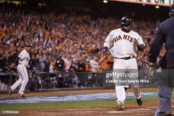 San Francisco Giants third baseman Pablo Sandoval scores in the 8th inning off a two-run double by San Francisco Giants left fielder Juan Perez ,...