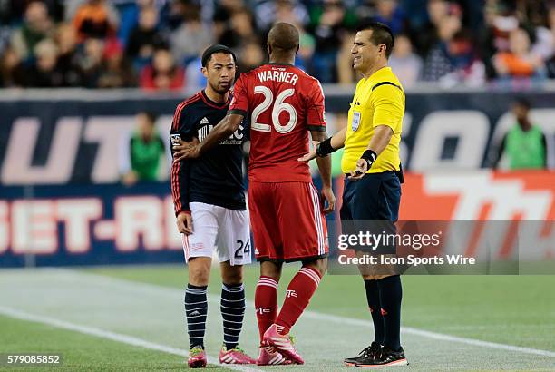 Referee Ricardo Salazar just wants Toronto FC's Collen Warner and New England Revolution's Lee Nguyen to get along. The New England Revolution...