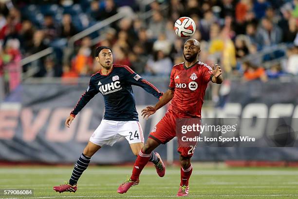 Toronto FC's Collen Warner looks for help with New England Revolution's Lee Nguyen ball watching. The New England Revolution defeated Toronto FC 1-0...