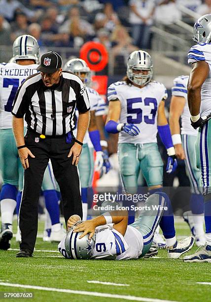 Dallas Cowboys Quarterback Tony Romo [3808] lays on ground after being sacked during a regular season NFL football game between the Dallas Cowboys...