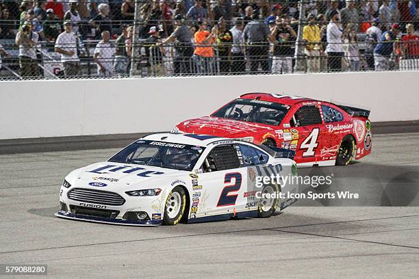 Sprint Cup Series driver Brad Keselowski, driver of the Miller Lite Ford fighting for position with Kevin Harvick, driver of the Budweiser Chevrolet...