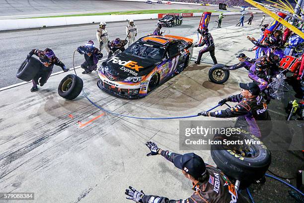 Sprint Cup Series the pit crew of driver Jeff Gordon, driver of the Drive to End Hunger Chevrolet rushing during a pit stop of the Federated Auto...