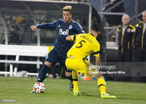 Erik Hurtado of the Vancouver Whitecaps FC controls the ball whole being guarded by Giancarlo Gonzalez of the Columbus Crew during the game between...