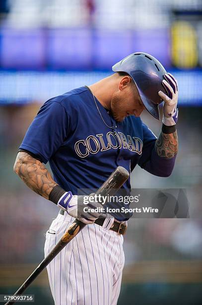 Colorado Rockies right fielder Brandon Barnes gets ready to bat during a regular season Major League Baseball inter-league game between the Texas...