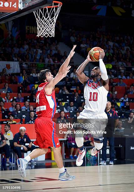 Kyrie Irving of Team USA goes to the basket past G Milos Teodosic of Serbia during Team USA's game versus Serbia in the 2014 FIBA Basketball World...