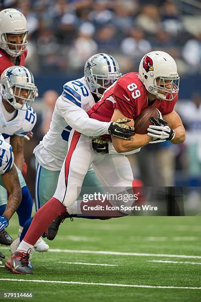 Dallas Cowboys linebacker Rolando McClain tackles Arizona Cardinals tight end John Carlson during a football game between the Dallas Cowboys and...