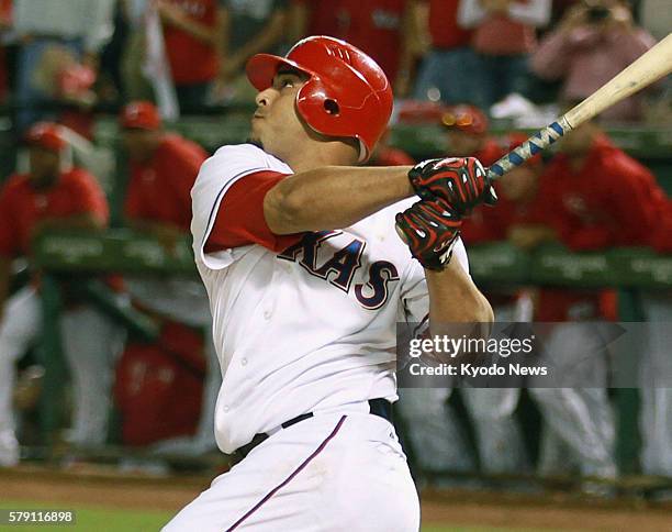 United States - Texas Rangers right fielder Nelson Cruz hits the first walk-off grand slam in postseason history in the 11th inning in Game 2 of the...