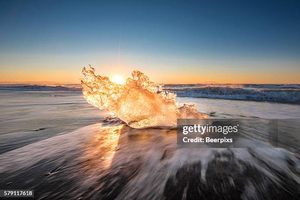 ice crystal on the ice beach at jokulsarlon, iceland. - jokulsarlon stock pictures, royalty-free photos & images