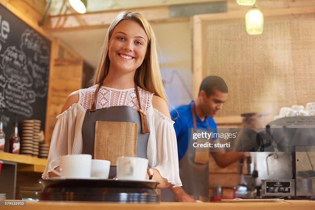 Happy young female barista