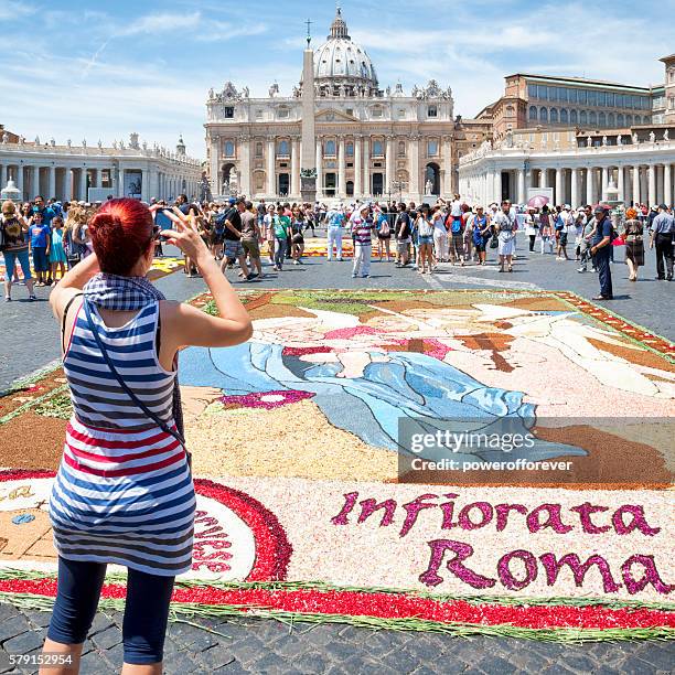 tourist photographing flower petal art at vatican city - st peter's square stock pictures, royalty-free photos & images