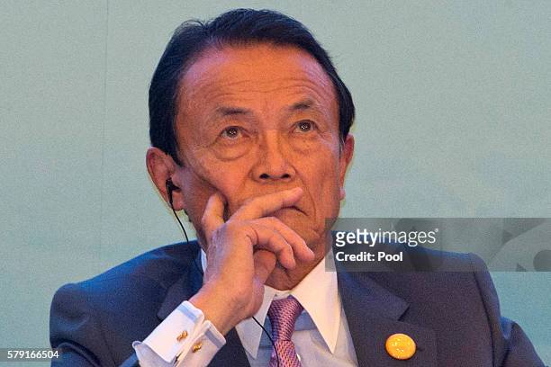 Taro Aso,Japan's Deputy Prime Minister attends a panel for the High-level Tax Symposium held in Chengdu in Southwestern China's Sichuan province,...