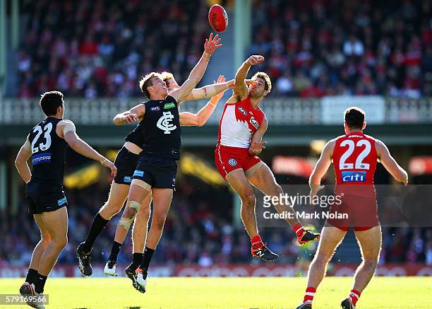 Patrick Cripps of Carlton and Josh P Kennedy of the Swans contest possession during the round 18 AFL match between the Sydney Swans and the Carlton...