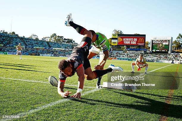 Manu Vatuvei of the Warriors dives to score a try during the round 20 NRL match between the Canberra Raiders and the New Zealand Warriors at GIO...