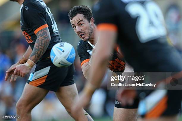 Justin Hunt of the WestsTigers passes the ball during the round 19 Intrust Super Premiership NSW match between the Wests Tigers and the Newtown Jets...