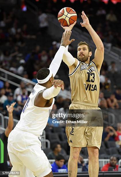 Andres Nocioni of Argentina shoots against Carmelo Anthony of the United States during a USA Basketball showcase exhibition game at T-Mobile Arena on...