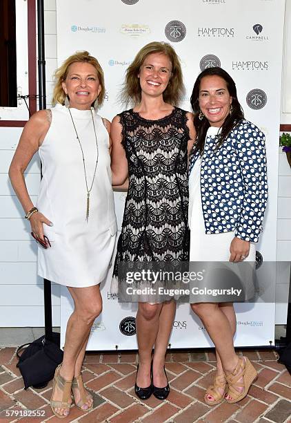 Debra Halpert, Melody Newberry, and Samantha Yanks attend the Douglas Elliman & Hamptons Magazine Celebrate Summer at Campbell Stables on July 22,...