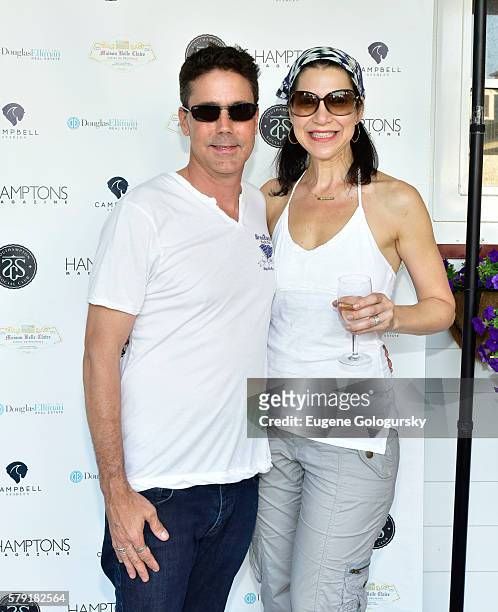 Christopher O'Brien, and Karen Parker O'Brien attend the Douglas Elliman & Hamptons Magazine Celebrate Summer at Campbell Stables on July 22, 2016 in...