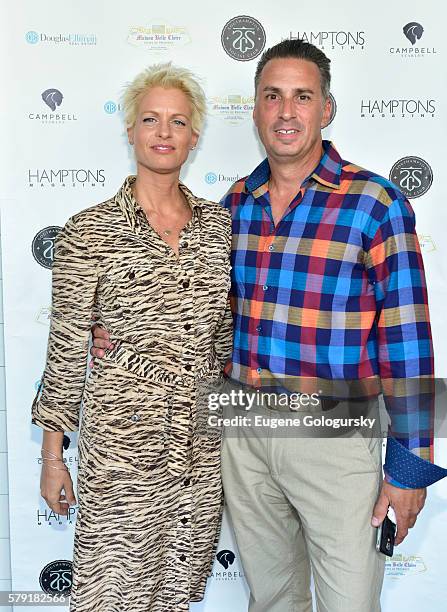 Michelle Passarella, and Joe Savio attend the Douglas Elliman & Hamptons Magazine Celebrate Summer at Campbell Stables on July 22, 2016 in...