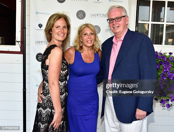 Melody Newberry, Dottie Herman, and Paul Brennan attend the Douglas Elliman & Hamptons Magazine Celebrate Summer at Campbell Stables on July 22, 2016...