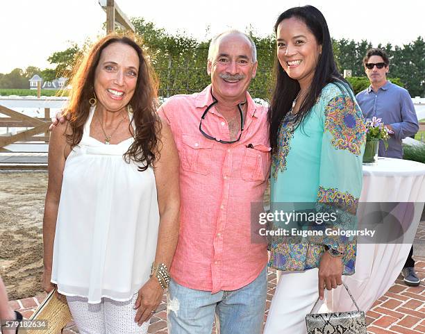 Amy Pink, Fred Lipsky, and Cassandra Seidenfield attend the Douglas Elliman & Hamptons Magazine Celebrate Summer at Campbell Stables on July 22, 2016...