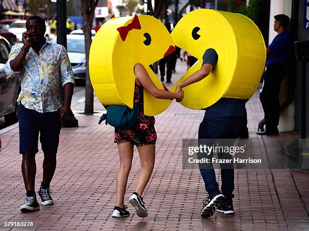 Pac-Man and Ms Pac-Man cosplayers attend Comic-Con International on July 22, 2016 in San Diego, California.