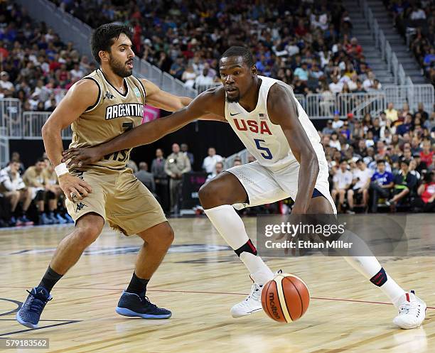 Kevin Durant of the United States drives against Facundo Campazzo of Argentina during a USA Basketball showcase exhibition game at T-Mobile Arena on...