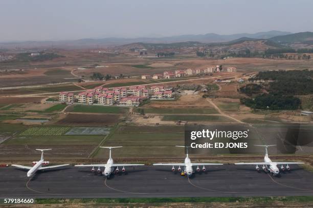 This photo taken on May 12, 2016 shows an aerial view of Air Koryo aircraft parked at Sunan airport in Pyongyang. - A fire forced a flight from North...