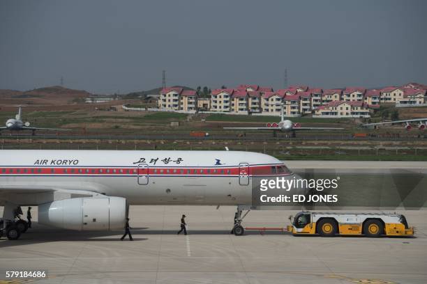 This photo taken on May 12, 2016 shows an Air Koryo Tupolev 204 aircraft as it taxis at Sunan airport in Pyongyang. - A fire forced a flight from...