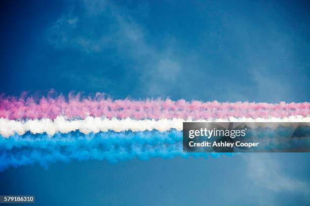 contrails from the red arrows display team. - red arrow stock pictures, royalty-free photos & images