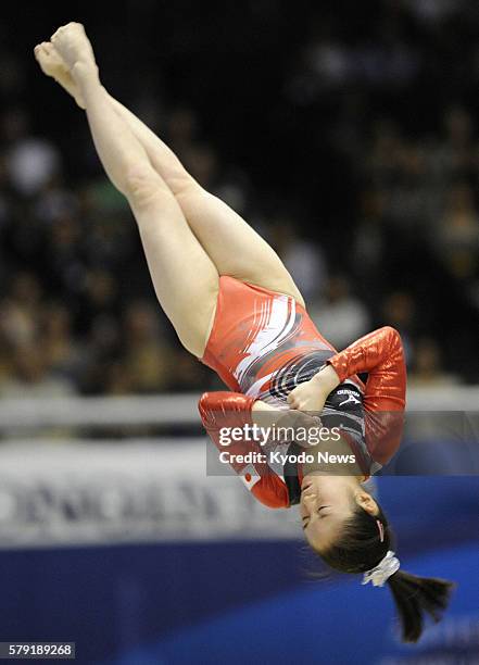 Japan - Koko Tsurumi of Japan flips in the air during her floor exercise in the women's all-around final at the world gymnastics championships in...