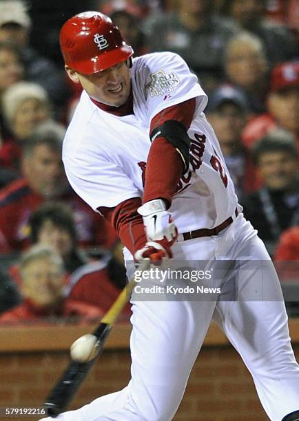 United States - St. Louis Cardinals' Allen Craig hits a tiebreaking single during the sixth inning of Game 1 of the World Series against the Texas...