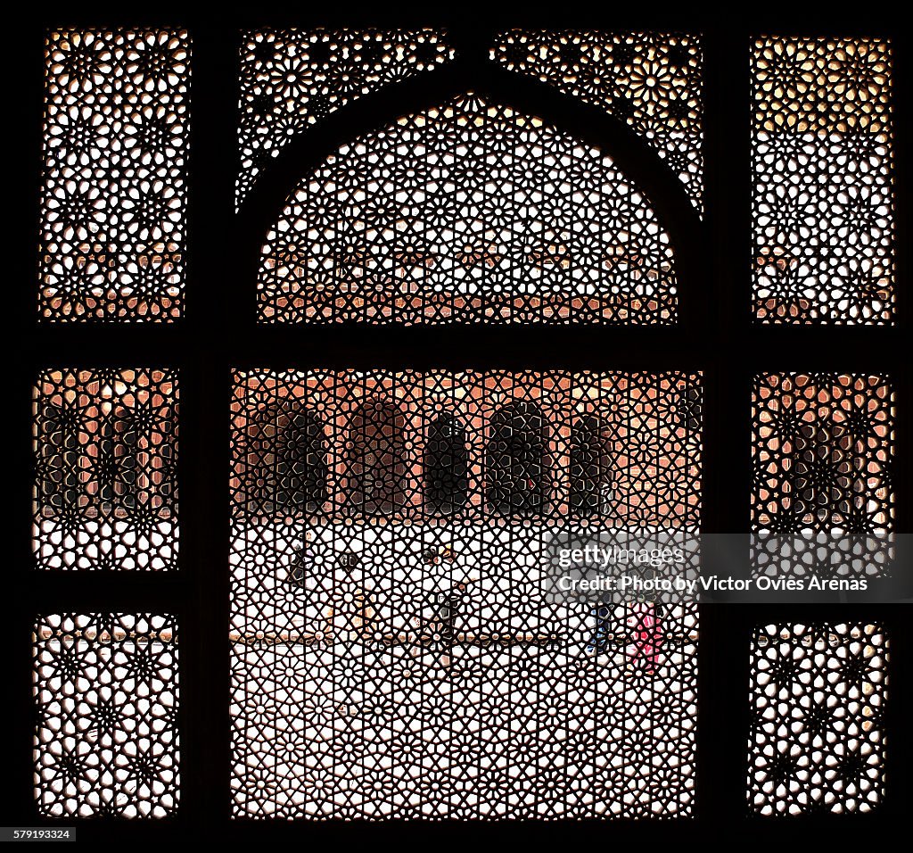 Courtyard of the Jama Masjid mosque in Fatehpur Sikri from a jalousie window in Agra, Uttar Pradesh, India