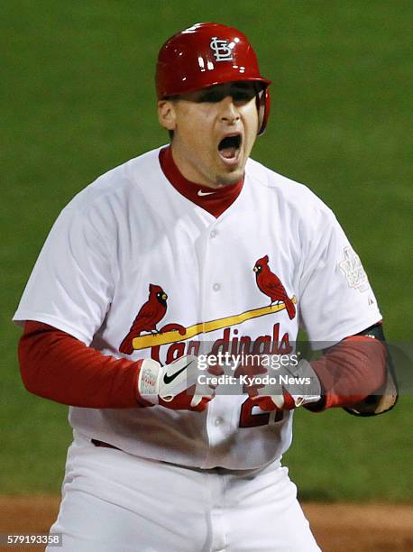 United States - St. Louis Cardinals' Allen Craig lets out a roar on first base after hitting a tiebreaking single during the sixth inning of Game 1...