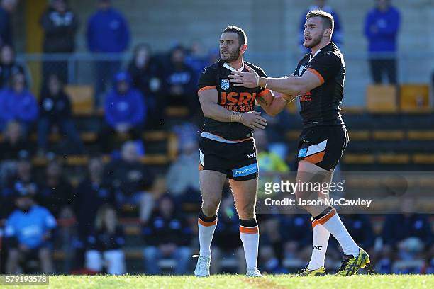 Robbie Farah of the WestsTigers watches on during the round 19 Intrust Super Premiership NSW match between the Wests Tigers and the Newtown Jets at...