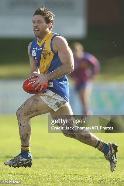 Cameron Lockwood of Williamstown runs with the ball during the round 16 VFL match between Port Melbourne and Williamstown at North Port Oval on July...