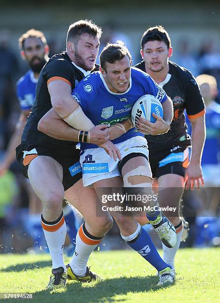 Kurt Capewell of the Newtown Jets runs with the ball during the round 19 Intrust Super Premiership NSW match between the Wests Tigers and the Newtown...