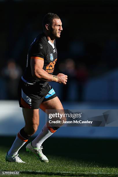 Robbie Farah of the WestsTigers watches on during the round 19 Intrust Super Premiership NSW match between the Wests Tigers and the Newtown Jets at...