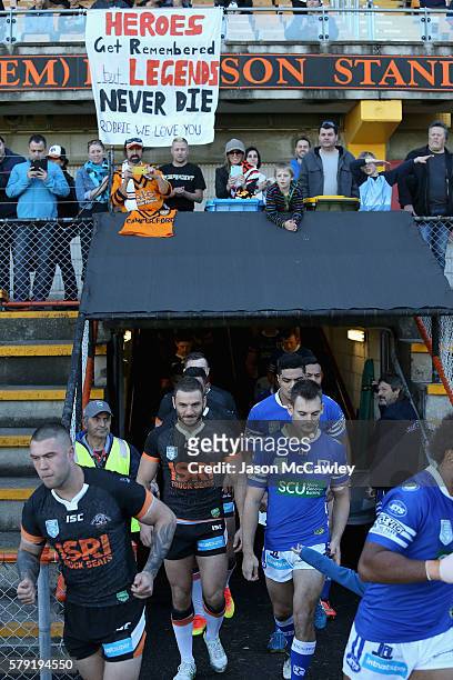 Robbie Farah of the WestsTigers makes his way onto the field during the round 19 Intrust Super Premiership NSW match between the Wests Tigers and the...