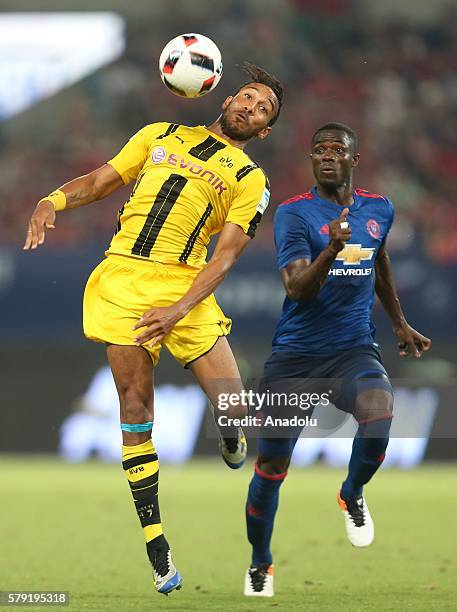 Eric Bailly of Manchester United in action against Pierre Emetic Aubameyang of Borussia Dortmund during the friendly match between Manchester United...