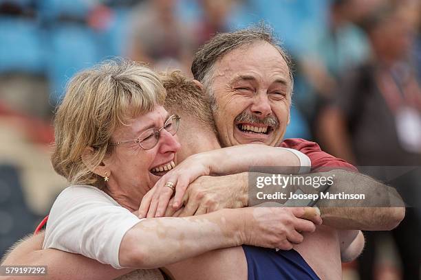 Callum Wilkinson of Great Britain celebrates winning a gold medal with his family in men's 10 000 metres race walk during the IAAF World U20...