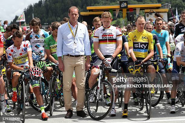 Poland's Rafal Majka, wearing the best climber's polka dot jersey, General director of the Tour de France, Christian Prudhomme, Germany's Andre...