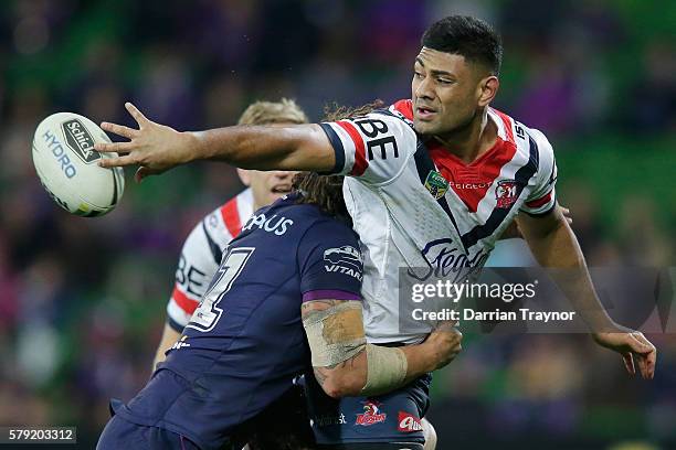 Daniel Tupou of the Roosters passes the ball during the round 20 NRL match between the Melbourne Storm and the Sydney Roosters at AAMI Park on July...