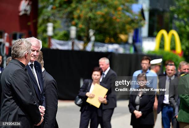 State Minister of Bavaria Horst Seehofer attends a wreath-lying ceremony outside the OEZ shopping center the day after a shooting spree left nine...