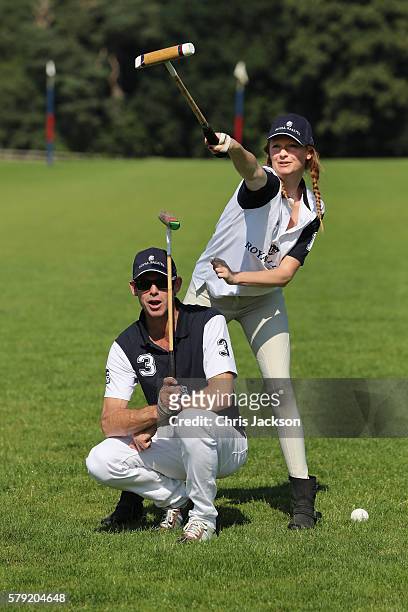 Professional Polo player Malcolm Borwick teaches Olivia Inge to play polo ahead of the Royal Salute Coronation Cup at Guards Polo Club on July 23,...